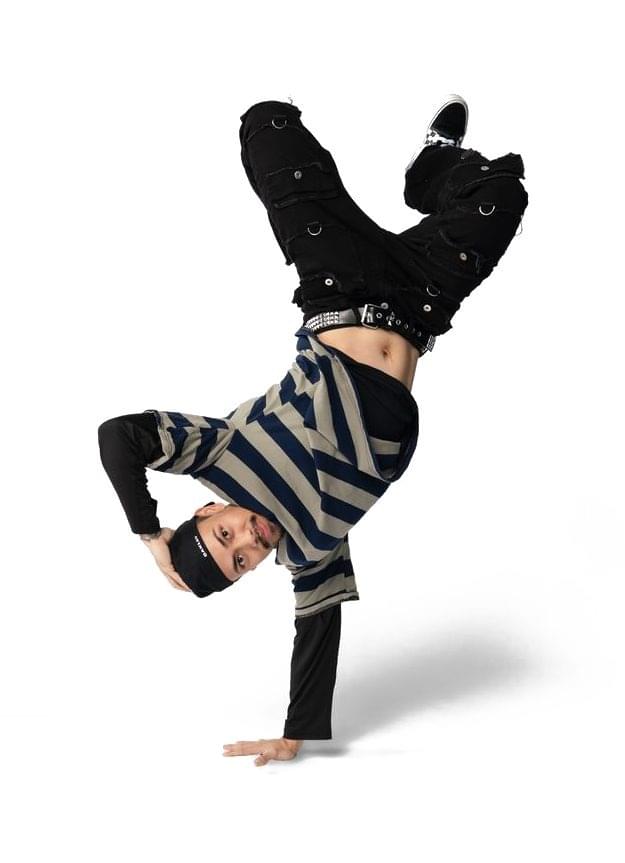 Punk Rock Brunch breakdancer doing a one-handed freeze