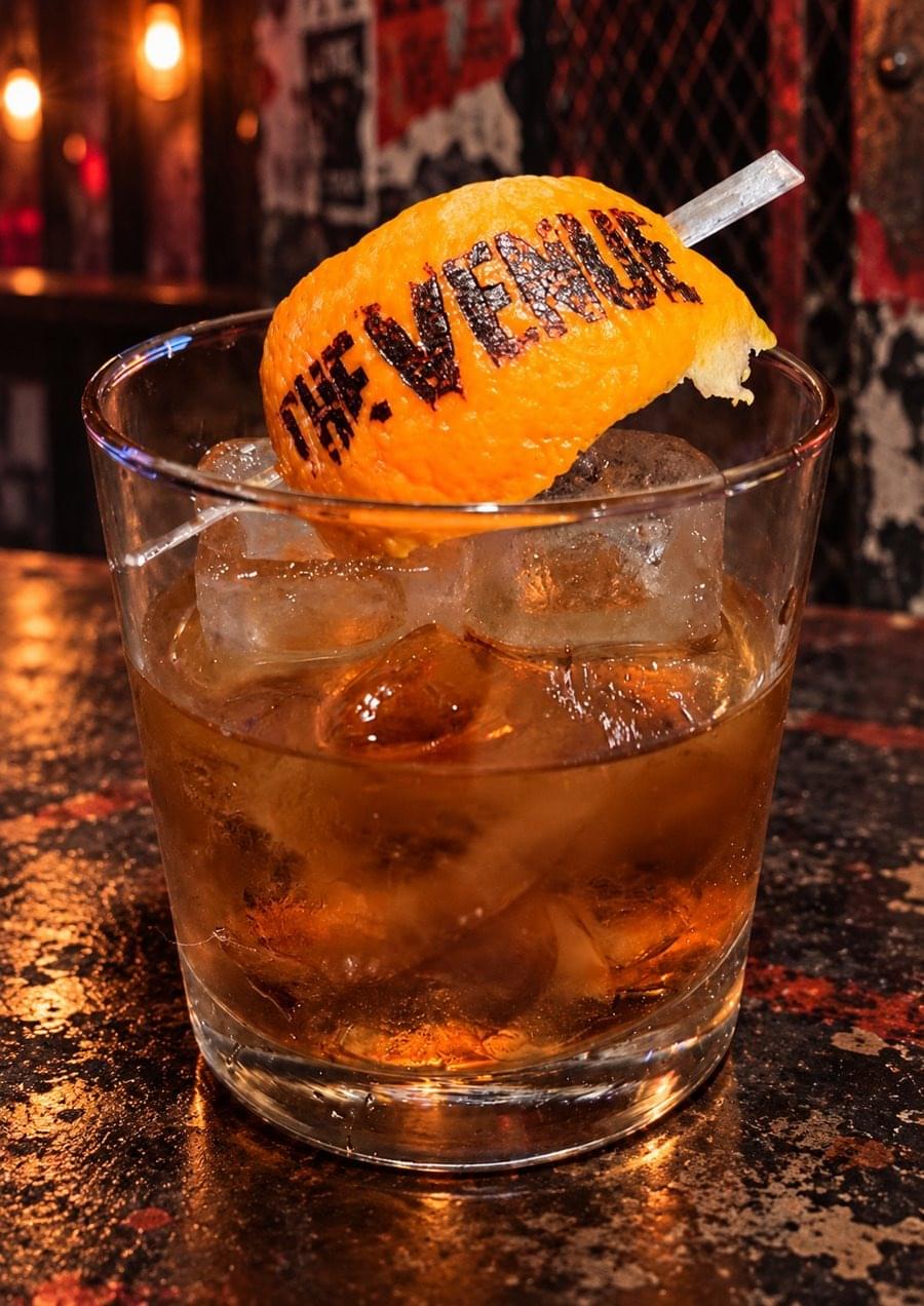 Old Fashion Riot bourbon cocktail with orange peel garnish at Punk Rock Brunch Las Vegas